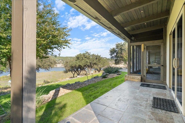 view of patio / terrace featuring a water view