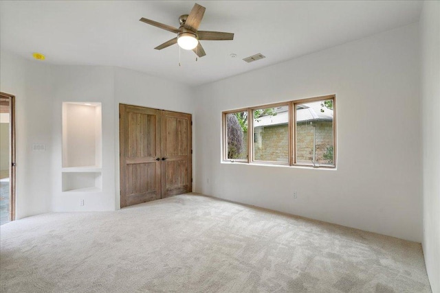 24736 Travis Lakeside Cv, Spicewood, TX 78669 - unfurnished bedroom with carpet and ceiling fan