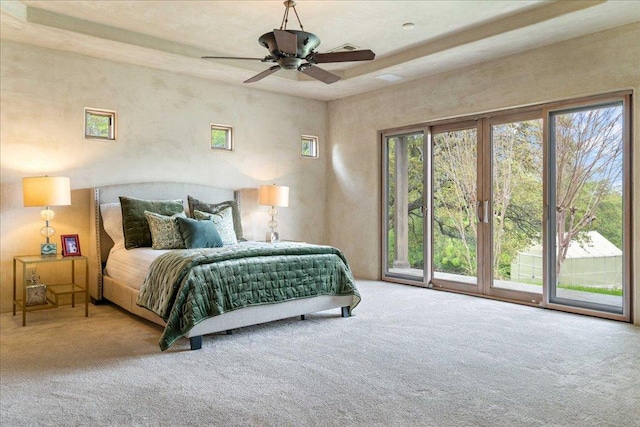 carpeted bedroom with access to outside