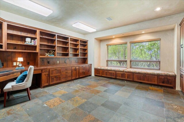 office area featuring built in desk, stone tile floors, visible vents, and recessed lighting