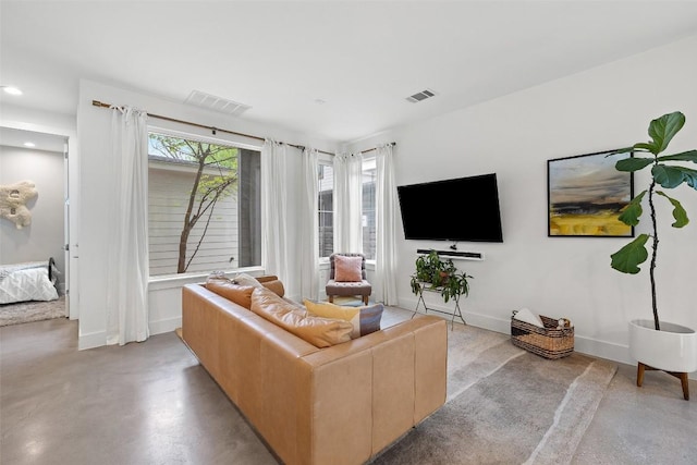 1503 Richcreek Rd Unit A, Austin, TX 78757 - living room with baseboards and concrete flooring