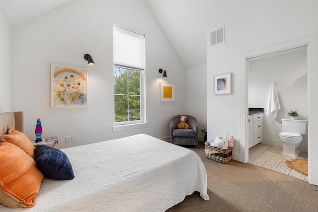 1503 Richcreek Rd Unit A, Austin, TX 78757 - bedroom with carpet floors, high vaulted ceiling, and ensuite bath