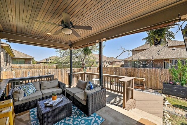 2605 Etta May Ln, Leander, TX 78641 - fenced backyard with an outdoor living space, a deck, a ceiling fan, and a residential view