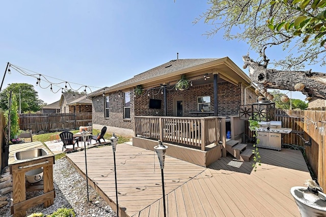 2605 Etta May Ln, Leander, TX 78641 - wooden deck with a fenced backyard and a grill