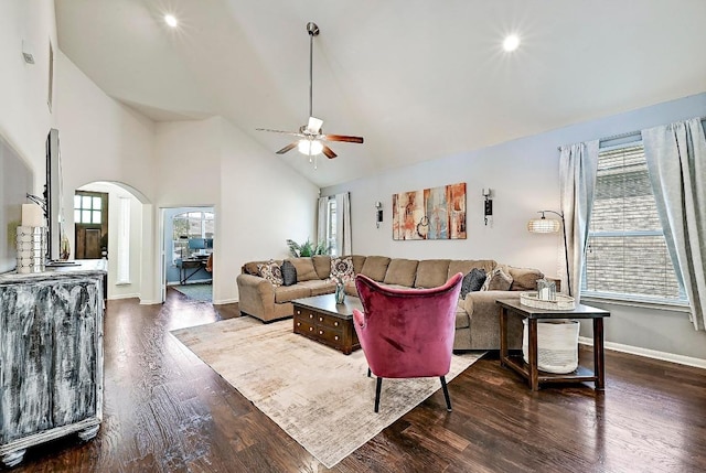2605 Etta May Ln, Leander, TX 78641 - living area featuring a ceiling fan, dark wood-style floors, arched walkways, baseboards, and high vaulted ceiling