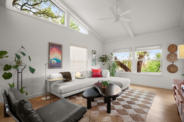 2007 Alameda Dr, Austin, TX 78704 - living area with a ceiling fan, healthy amount of natural light, light wood-style floors, high vaulted ceiling, and beamed ceiling