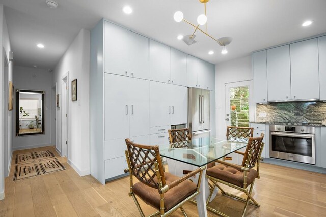 2007 Alameda Dr, Austin, TX 78704 - dining area featuring light wood-style floors and recessed lighting