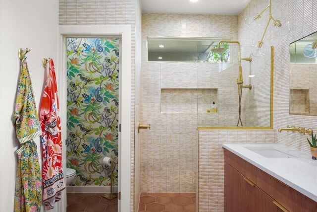 2007 Alameda Dr, Austin, TX 78704 - bathroom featuring tile patterned flooring, a tile shower, and vanity