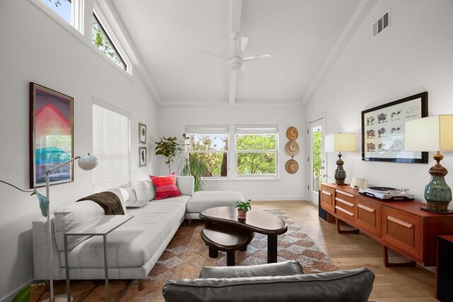 2007 Alameda Dr, Austin, TX 78704 - living room featuring a ceiling fan, light wood finished floors, crown molding, beam ceiling, and high vaulted ceiling