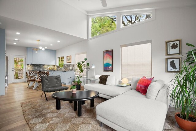 2007 Alameda Dr, Austin, TX 78704 - living area with healthy amount of natural light, a high ceiling, light wood finished floors, and recessed lighting
