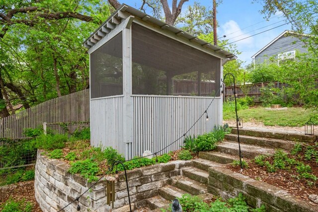 2007 Alameda Dr, Austin, TX 78704 - view of outbuilding featuring a sunroom and a fenced backyard