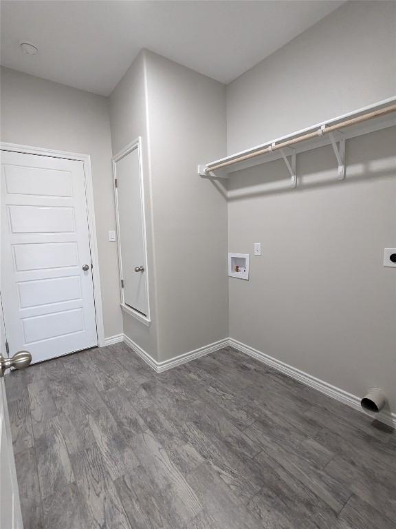 407 Gamel St, Lampasas, TX 76550 - laundry room with wood finished floors, washer hookup, and baseboards