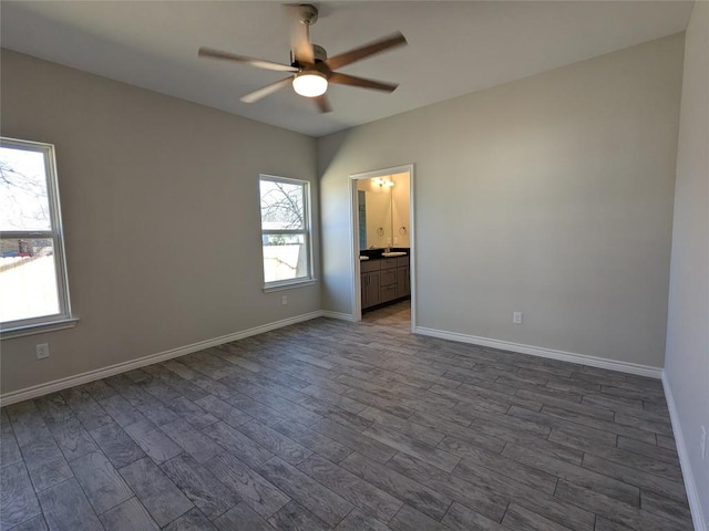 407 Gamel St, Lampasas, TX 76550 - spare room with a ceiling fan and dark wood-style flooring