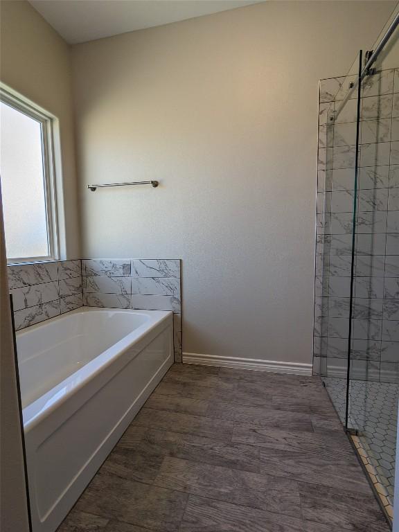 407 Gamel St, Lampasas, TX 76550 - bathroom featuring a garden tub and a shower stall