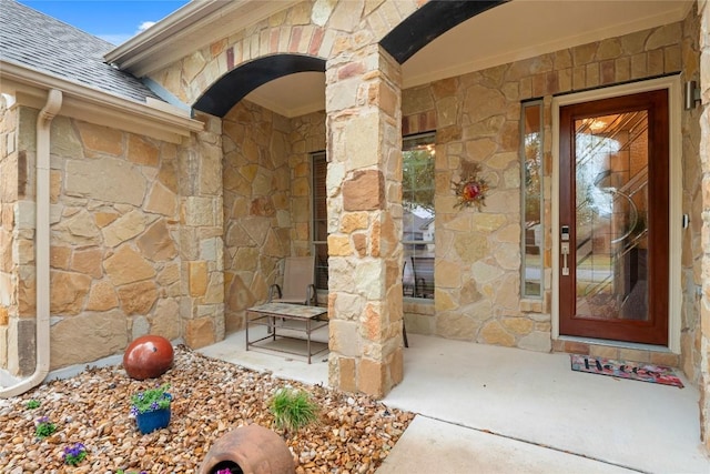2009 Manada Trl, Cedar Park, TX 78641 - property entrance with stone siding, roof with shingles, and a porch