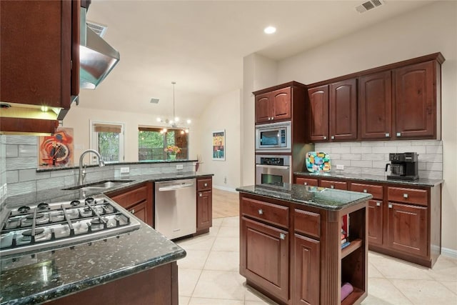 2009 Manada Trl, Cedar Park, TX 78641 - kitchen with appliances with stainless steel finishes, backsplash, light tile patterned floors, lofted ceiling, and dark stone counters