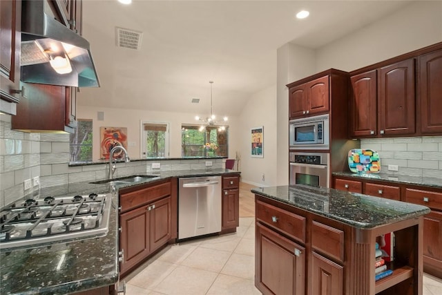 2009 Manada Trl, Cedar Park, TX 78641 - kitchen featuring stainless steel appliances, range hood, tasteful backsplash, lofted ceiling, and a chandelier