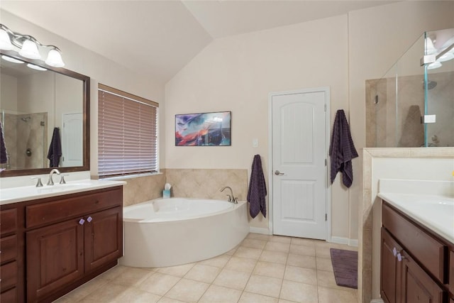 2009 Manada Trl, Cedar Park, TX 78641 - bathroom featuring lofted ceiling, two vanities, a stall shower, a bath, and tile patterned flooring