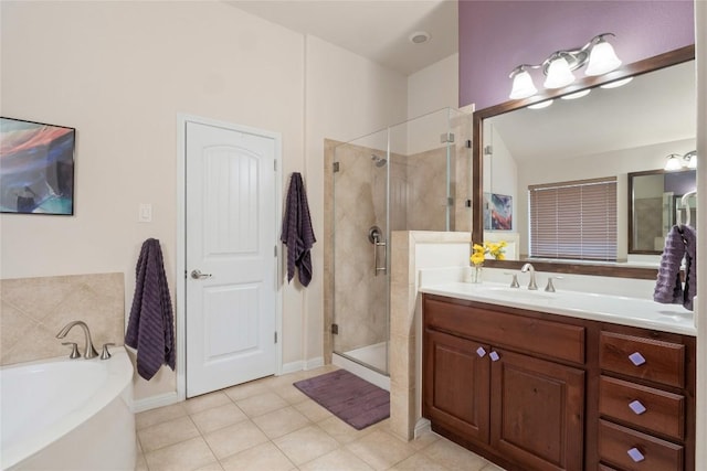 2009 Manada Trl, Cedar Park, TX 78641 - full bathroom featuring vanity, a shower stall, a garden tub, and tile patterned flooring