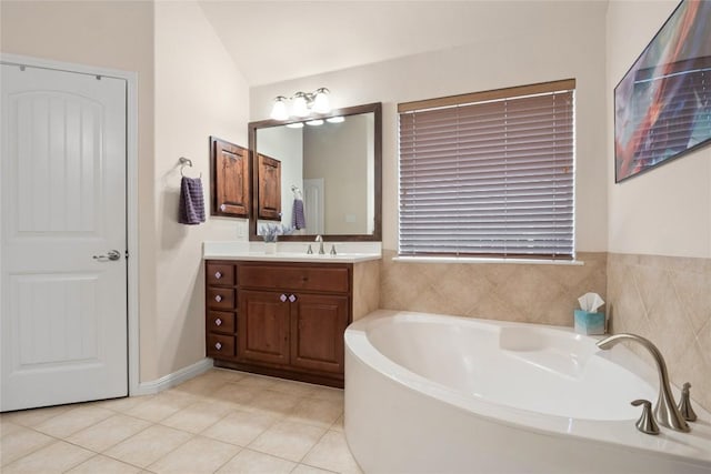 2009 Manada Trl, Cedar Park, TX 78641 - full bath featuring a bath, vanity, tile patterned floors, and lofted ceiling