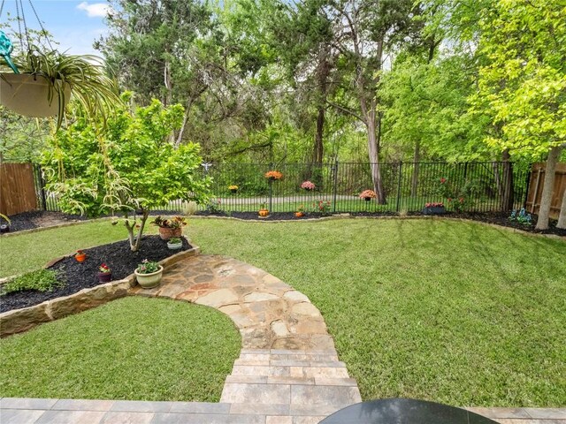 view of yard featuring a fenced backyard and a patio