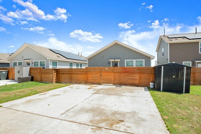 197 Buenos Aires, Kyle, TX 78640 - rear view of property with a shed and an outdoor structure