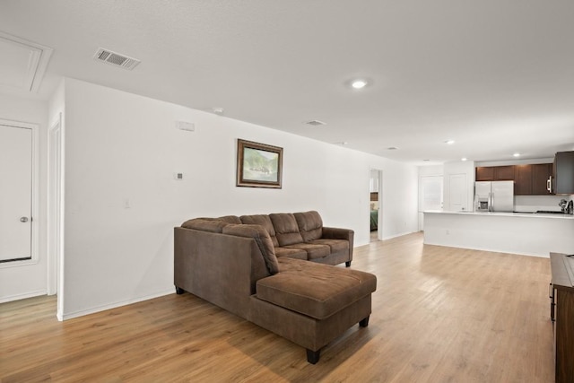 197 Buenos Aires, Kyle, TX 78640 - living room with attic access, light wood-type flooring, recessed lighting, and baseboards