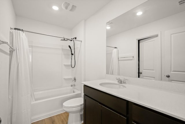 197 Buenos Aires, Kyle, TX 78640 - full bath with wood finished floors, vanity, shower / tub combo, toilet, and recessed lighting