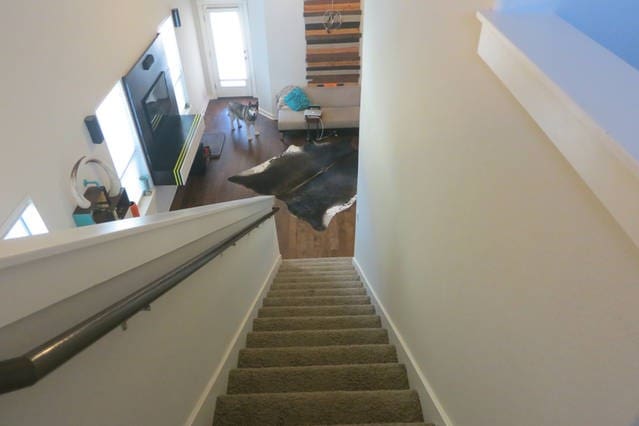 2101 Rivers Edge Way Unit 17, Austin, TX 78741 - stairs with wood finished floors and baseboards
