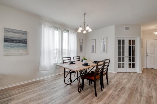 2300 Cliffbrake Way, Georgetown, TX 78626 - dining room featuring light wood finished floors, a chandelier, french doors, and baseboards