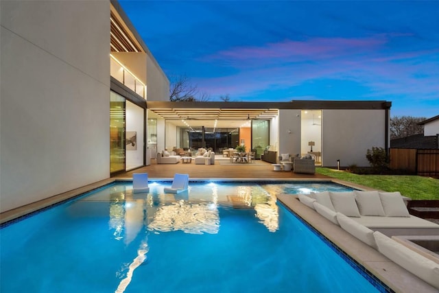 2605 Rockingham Dr, Austin, TX 78704 - pool at dusk featuring an outdoor living space, fence, and a fenced in pool