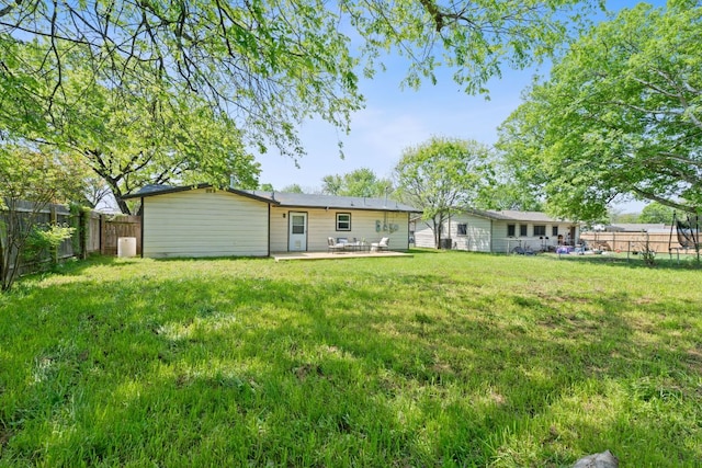306 Tilbury Ln, Austin, TX 78745 - back of property featuring a fenced backyard