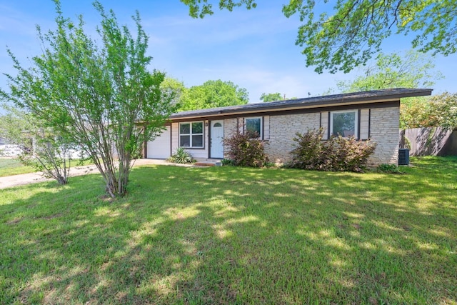 306 Tilbury Ln, Austin, TX 78745 - ranch-style house featuring a garage, a front lawn, stone siding, and central air condition unit