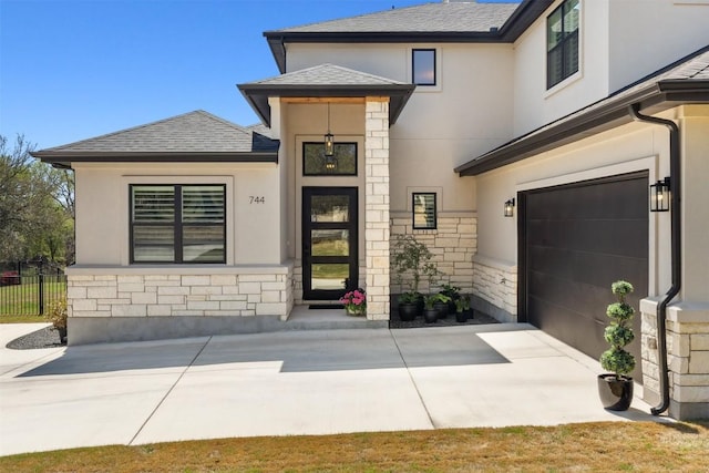 744 Buffalo Trl, Liberty Hill, TX 78642 - view of front facade featuring stone siding, stucco siding, a garage, and a shingled roof