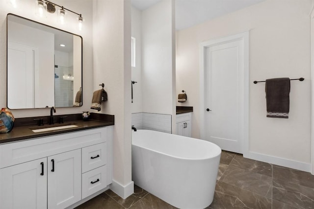 744 Buffalo Trl, Liberty Hill, TX 78642 - full bath featuring marble look tiles, vanity, a freestanding bath, and a shower