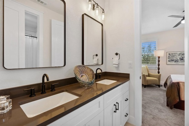 744 Buffalo Trl, Liberty Hill, TX 78642 - ensuite bathroom featuring double vanity and a ceiling fan