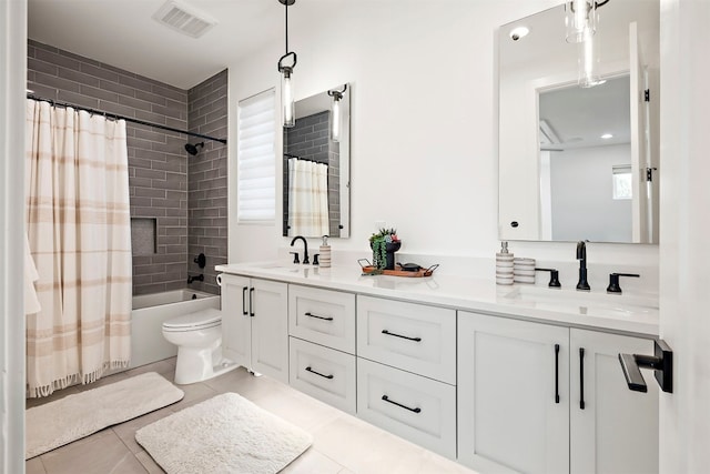 bathroom with visible vents, double vanity, shower / tub combo, and a sink