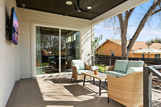 exterior space with an outdoor living space and ceiling fan