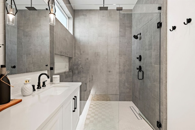 full bathroom with vanity and a stall shower