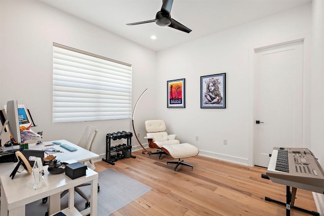 office area featuring baseboards, recessed lighting, a ceiling fan, and light wood-style flooring