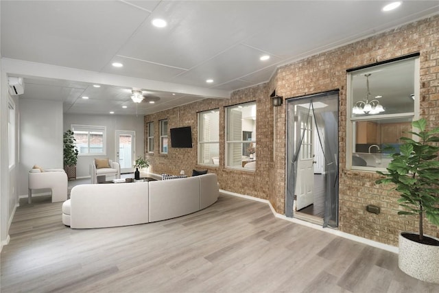 8613 Columbia Falls Dr, Round Rock, TX 78681 - living area with brick wall, baseboards, wood finished floors, recessed lighting, and ceiling fan