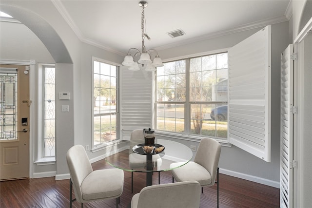 8613 Columbia Falls Dr, Round Rock, TX 78681 - dining room featuring a chandelier, arched walkways, wood-type flooring, and ornamental molding