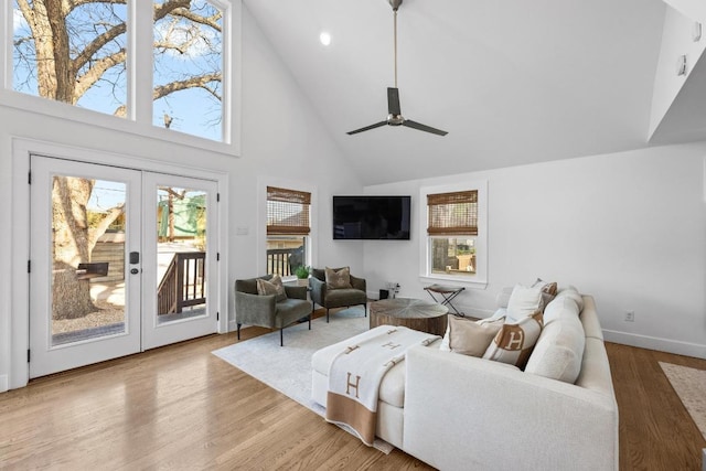 1802 Eva St, Austin, TX 78704 - living area featuring high vaulted ceiling, healthy amount of natural light, wood finished floors, french doors, and a ceiling fan