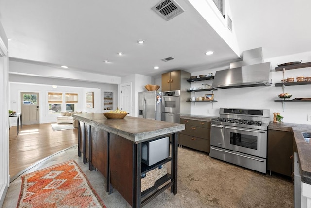 1802 Eva St, Austin, TX 78704 - kitchen featuring open shelves, stainless steel appliances, wall chimney exhaust hood, dark countertops, and recessed lighting