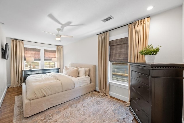 1802 Eva St, Austin, TX 78704 - bedroom with baseboards, wood finished floors, and ceiling fan