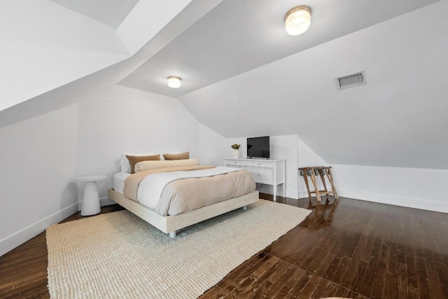 1802 Eva St, Austin, TX 78704 - bedroom with lofted ceiling, dark wood-type flooring, and baseboards