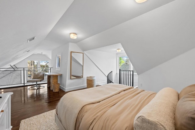 1802 Eva St, Austin, TX 78704 - bedroom featuring lofted ceiling, dark wood finished floors, multiple windows, and baseboards