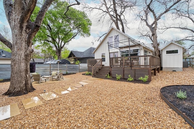 1802 Eva St, Austin, TX 78704 - rear view of property with board and batten siding, a wooden deck, a storage unit, stairs, and fence
