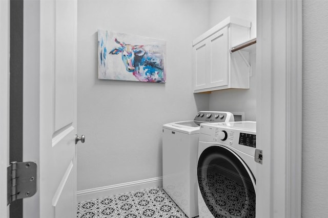 236 Diamondback Dr, Georgetown, TX 78628 - laundry area featuring washing machine and dryer, baseboards, and cabinet space