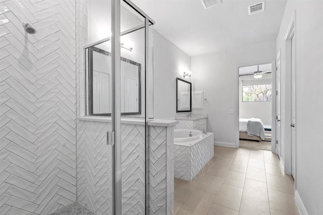 236 Diamondback Dr, Georgetown, TX 78628 - full bath featuring vanity, tiled shower, ensuite bathroom, and tile patterned flooring